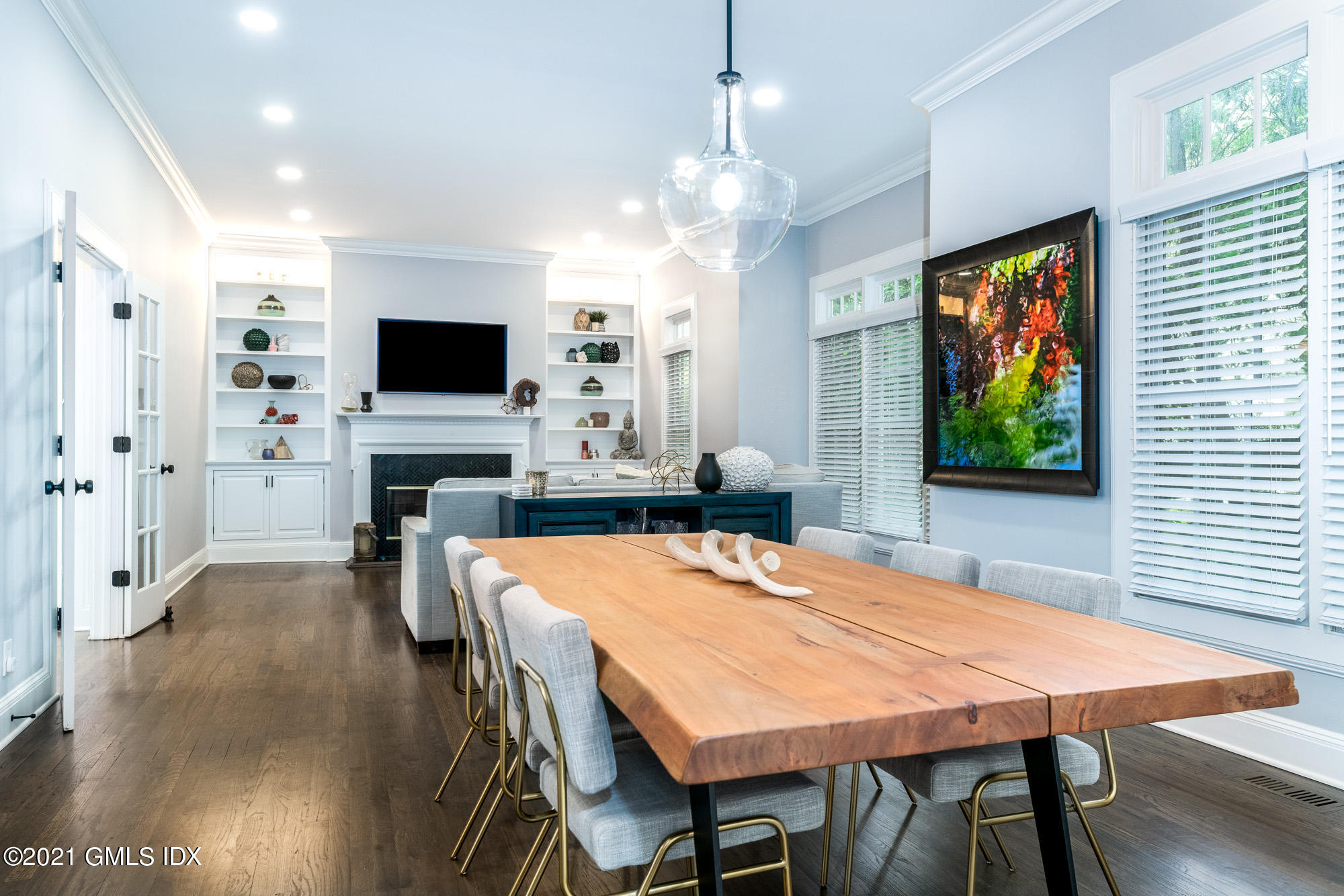 48 Spring Street, Unit 2 Greenwich, CT 06830 - Photo 10 of 36 a view of a dining room with furniture window and wooden floor