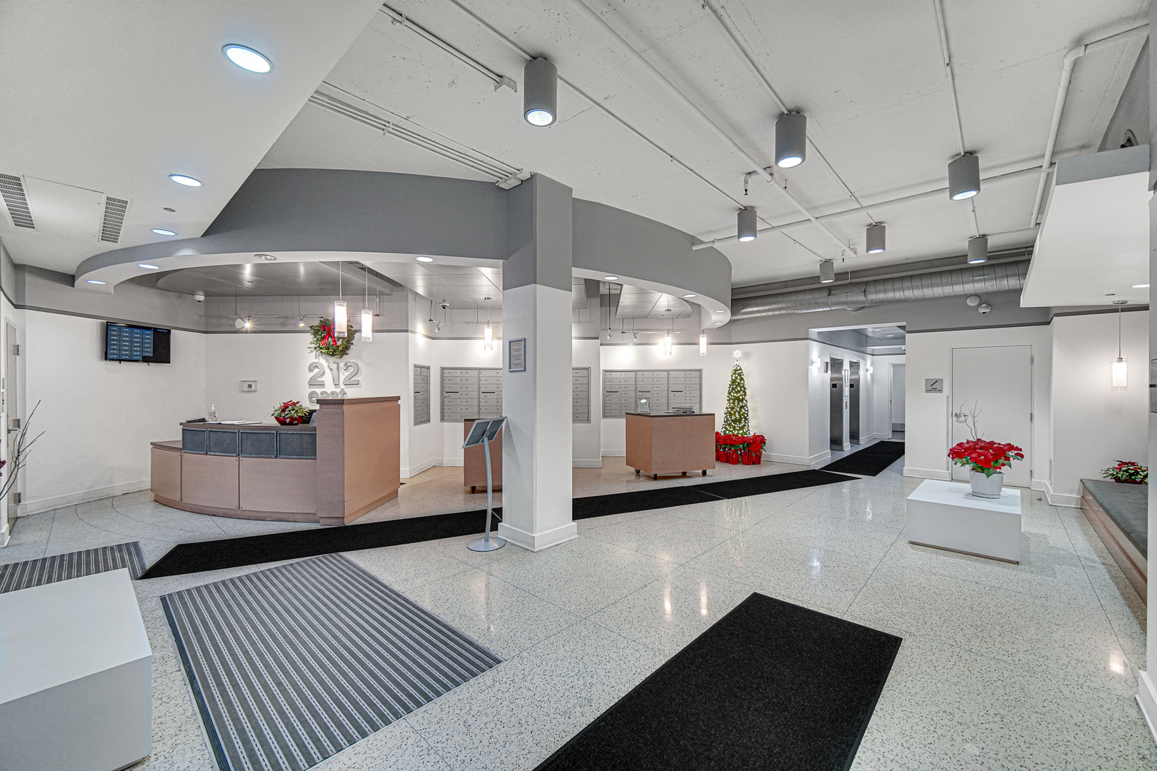 212 East Cullerton Street, Unit 811 Chicago, IL 60616 - Photo 17 of 18 a living room with lots of furniture and a chandelier
