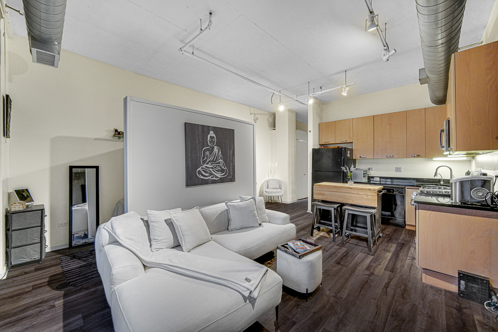 212 East Cullerton Street, Unit 811 Chicago, IL 60616 - Photo 4 of 18 a living room with furniture kitchen view and a wooden floor