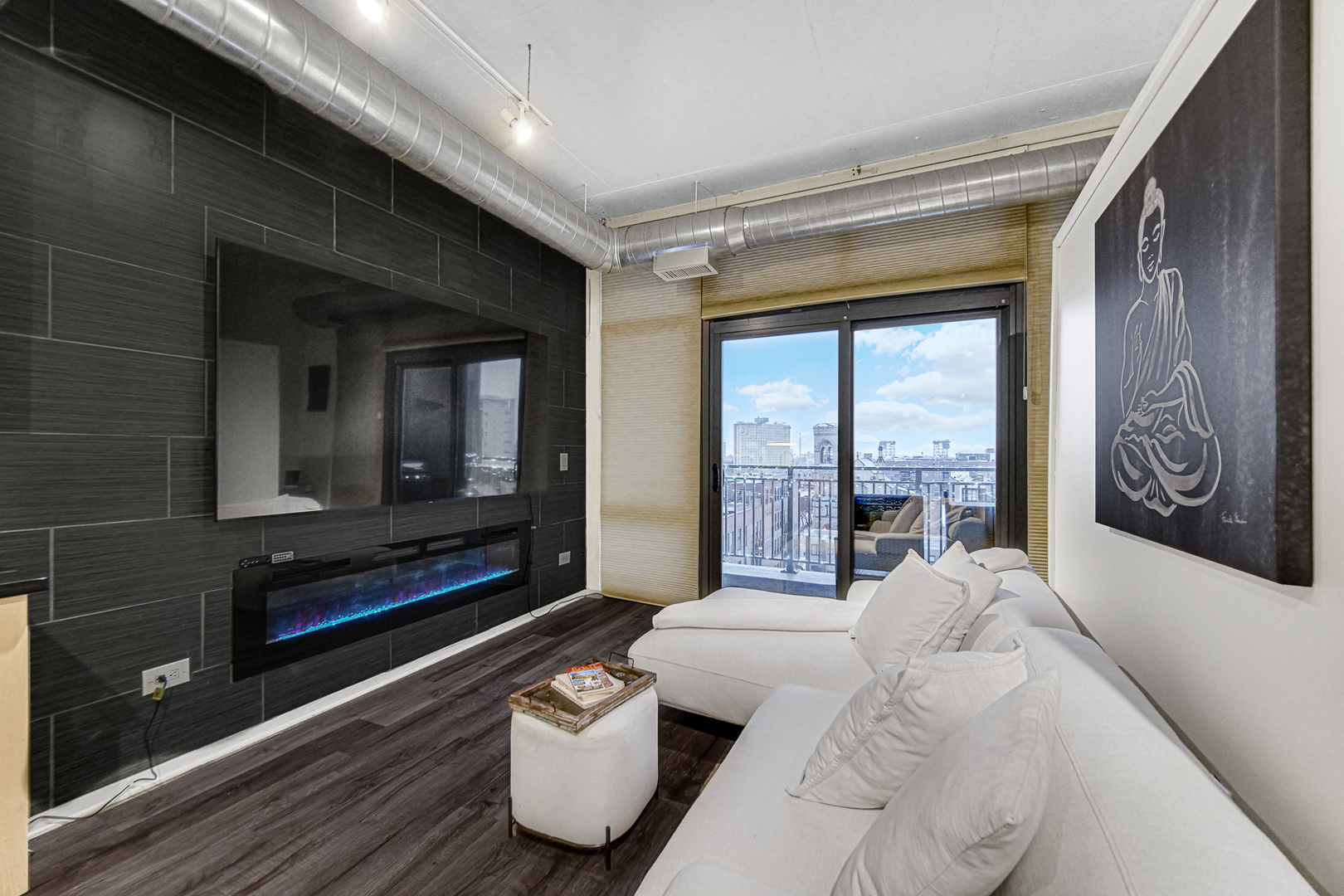 212 East Cullerton Street, Unit 811 Chicago, IL 60616 - Photo 6 of 18 a living room with furniture and a floor to ceiling window