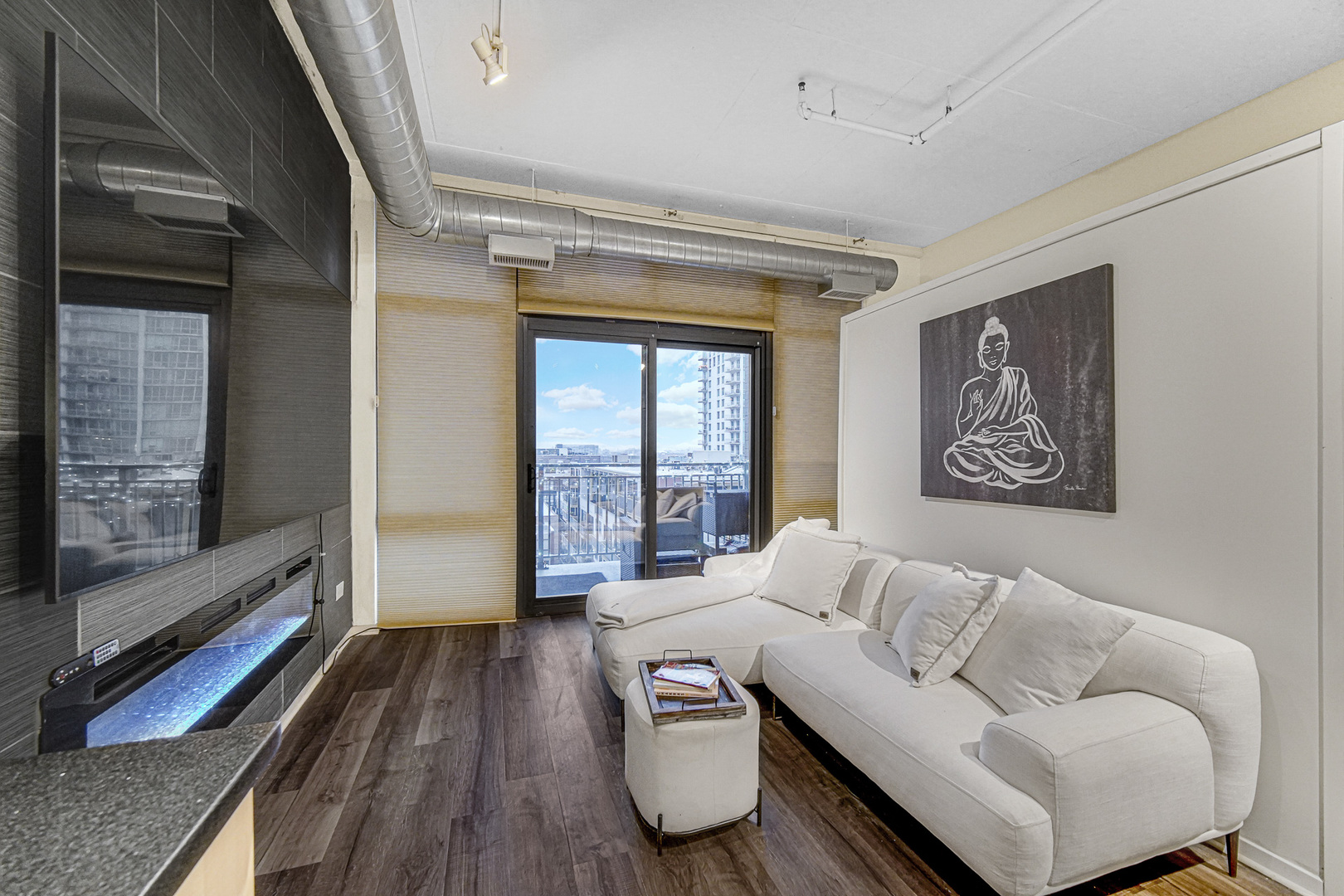 212 East Cullerton Street, Unit 811 Chicago, IL 60616 - Photo 7 of 18 a living room with furniture and a window