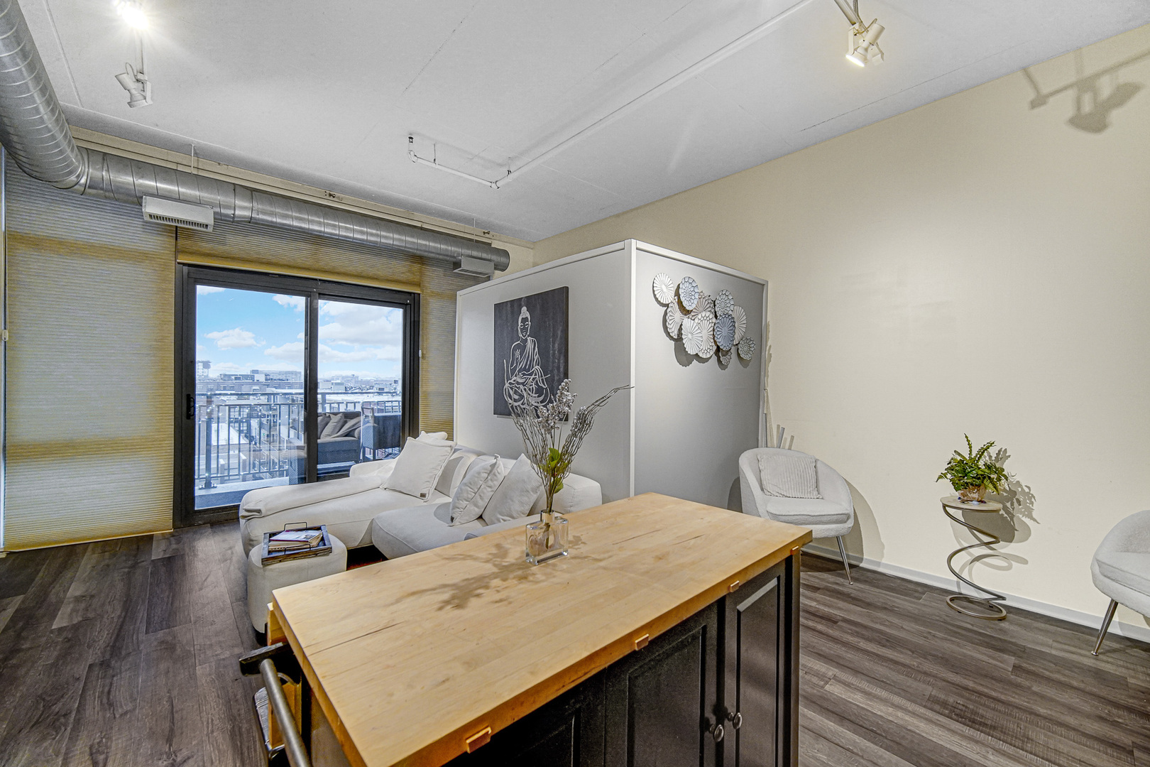 212 East Cullerton Street, Unit 811 Chicago, IL 60616 - Photo 8 of 18 a living room with furniture and wooden floor