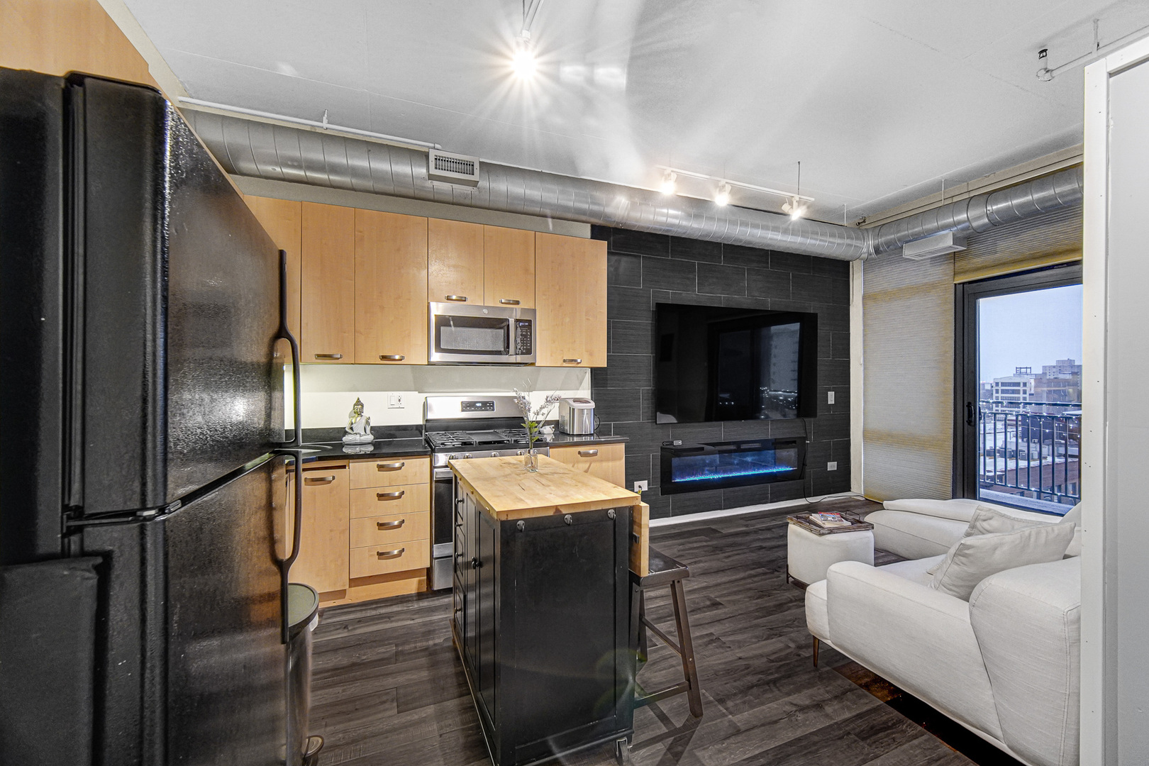 212 East Cullerton Street, Unit 811 Chicago, IL 60616 - Photo 10 of 18 a kitchen with stainless steel appliances granite countertop a refrigerator a stove and a sink