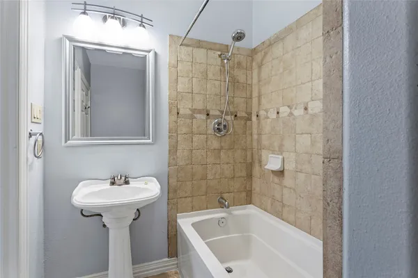 a view of room with window and cabinet