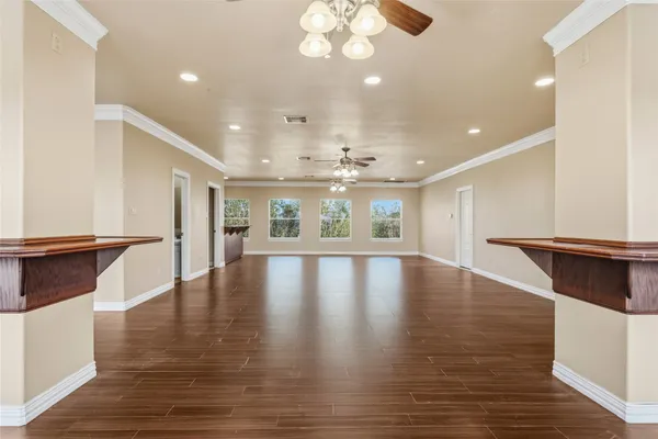 a view of a kitchen with a table and chairs