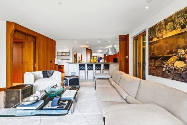 a kitchen with stainless steel appliances kitchen island furniture and a large window