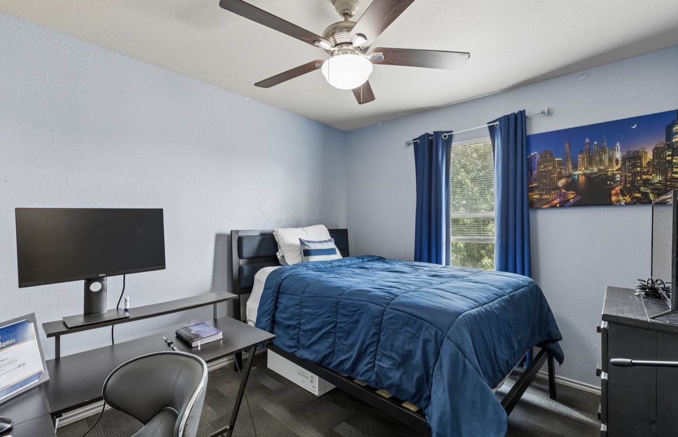 7118 Rising Brook Drive Cypress, TX 77433 - Photo 17 of 21 a bedroom with a bed tv and chair