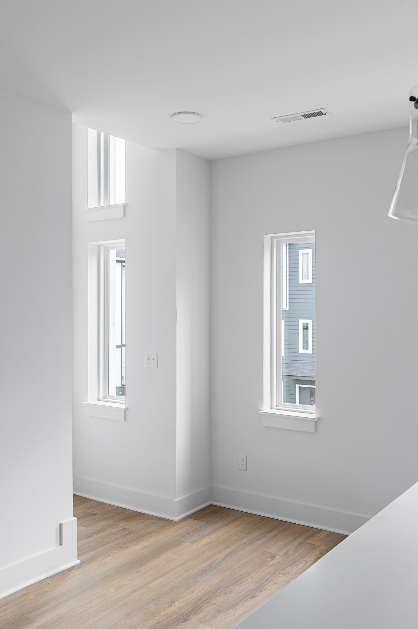 708 North Dupont Avenue Madison, TN 37115 - Photo 12 of 28 an empty room with wooden floor and windows