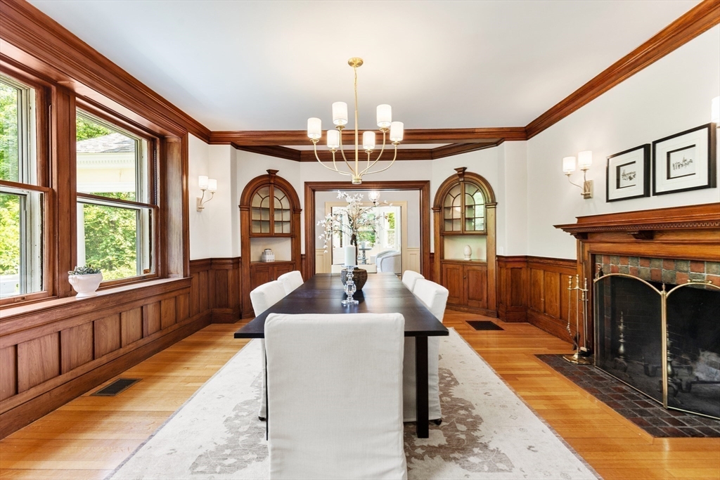 10 Eliot Road Lexington, MA 02421 - Photo 12 of 40 a living room with fireplace furniture and a large window