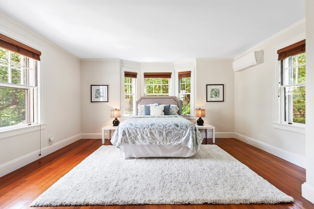 10 Eliot Road Lexington, MA 02421 - Photo 23 of 40 a spacious bedroom with a bed and wooden floor