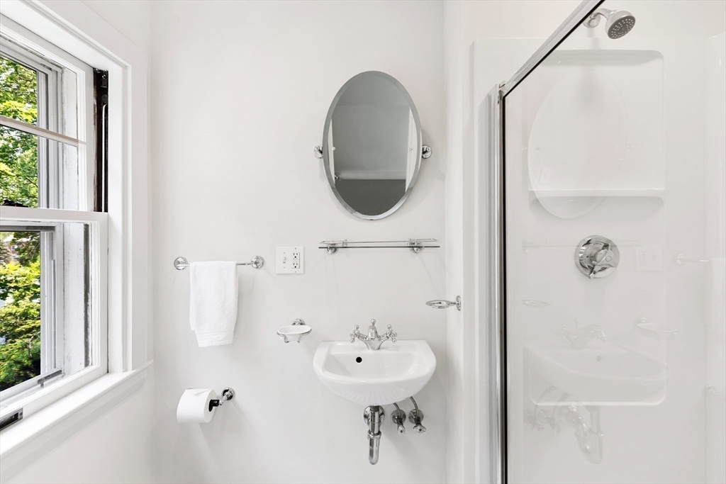 10 Eliot Road Lexington, MA 02421 - Photo 28 of 40 a bathroom with a sink and a mirror