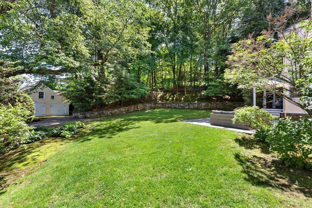 10 Eliot Road Lexington, MA 02421 - Photo 31 of 40 a view of a garden with large trees
