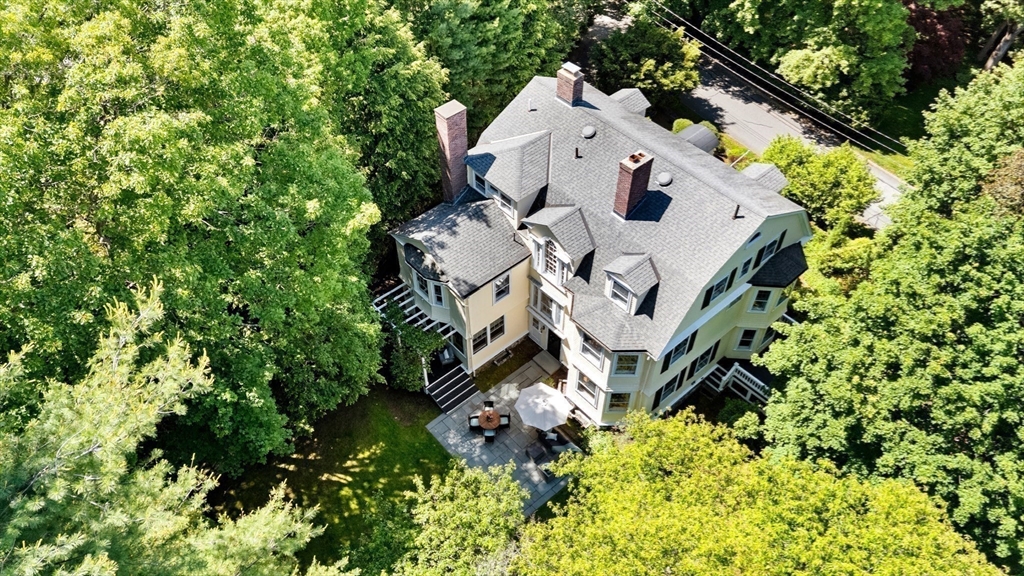 10 Eliot Road Lexington, MA 02421 - Photo 5 of 40 an aerial view of a house with a yard and garden