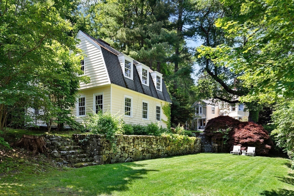 10 Eliot Road Lexington, MA 02421 - Photo 6 of 40 a front view of a house with a yard