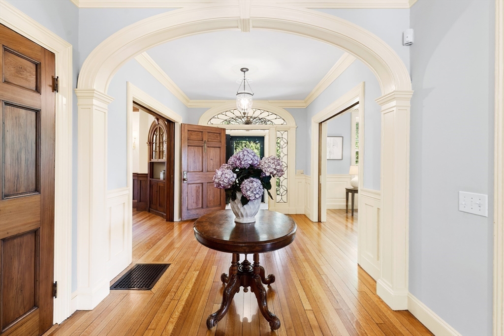 10 Eliot Road Lexington, MA 02421 - Photo 7 of 40 a dining room with chandelier and wooden floor