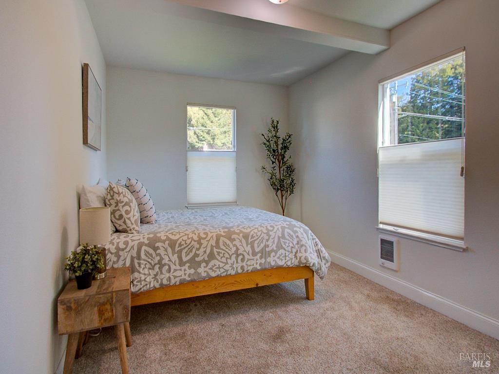 1002 Cedar Street Fort Bragg, CA 95437 - Photo 15 of 26 a bedroom with a bed and a window