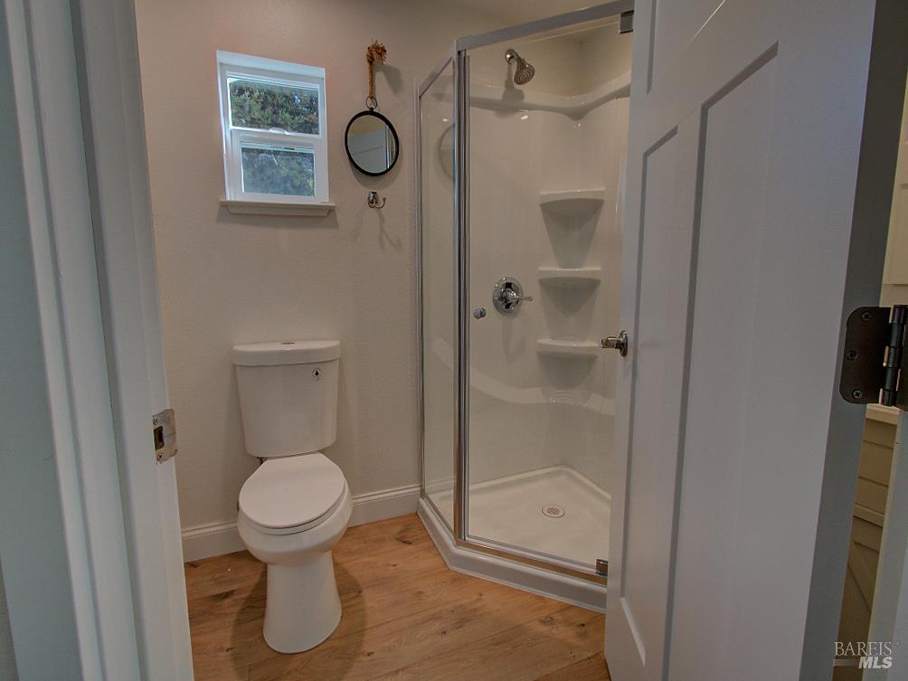 1002 Cedar Street Fort Bragg, CA 95437 - Photo 16 of 26 a bathroom with a toilet and a shower