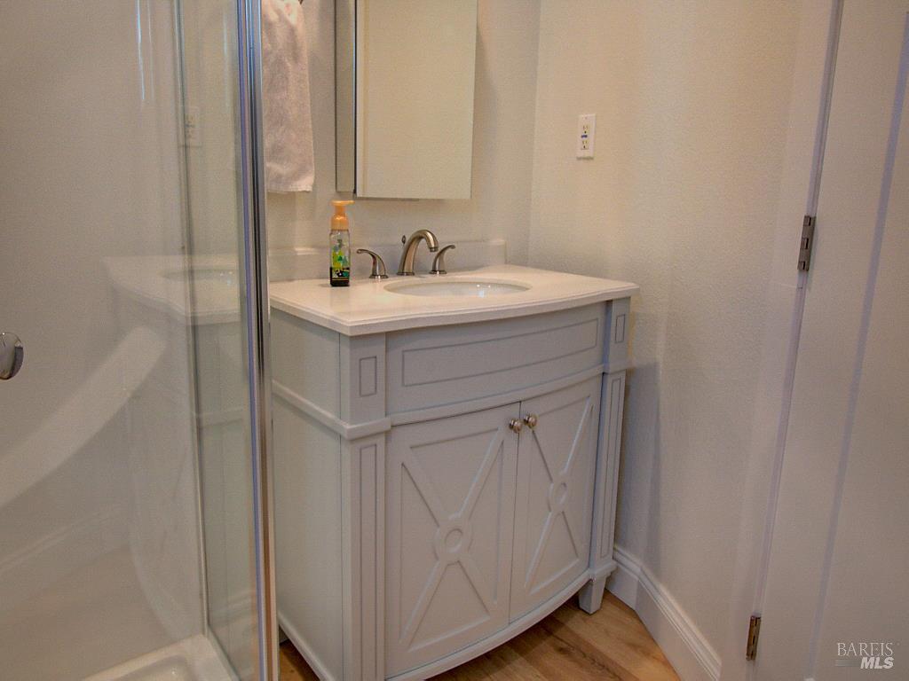 1002 Cedar Street Fort Bragg, CA 95437 - Photo 17 of 26 a bathroom with a sink and a mirror