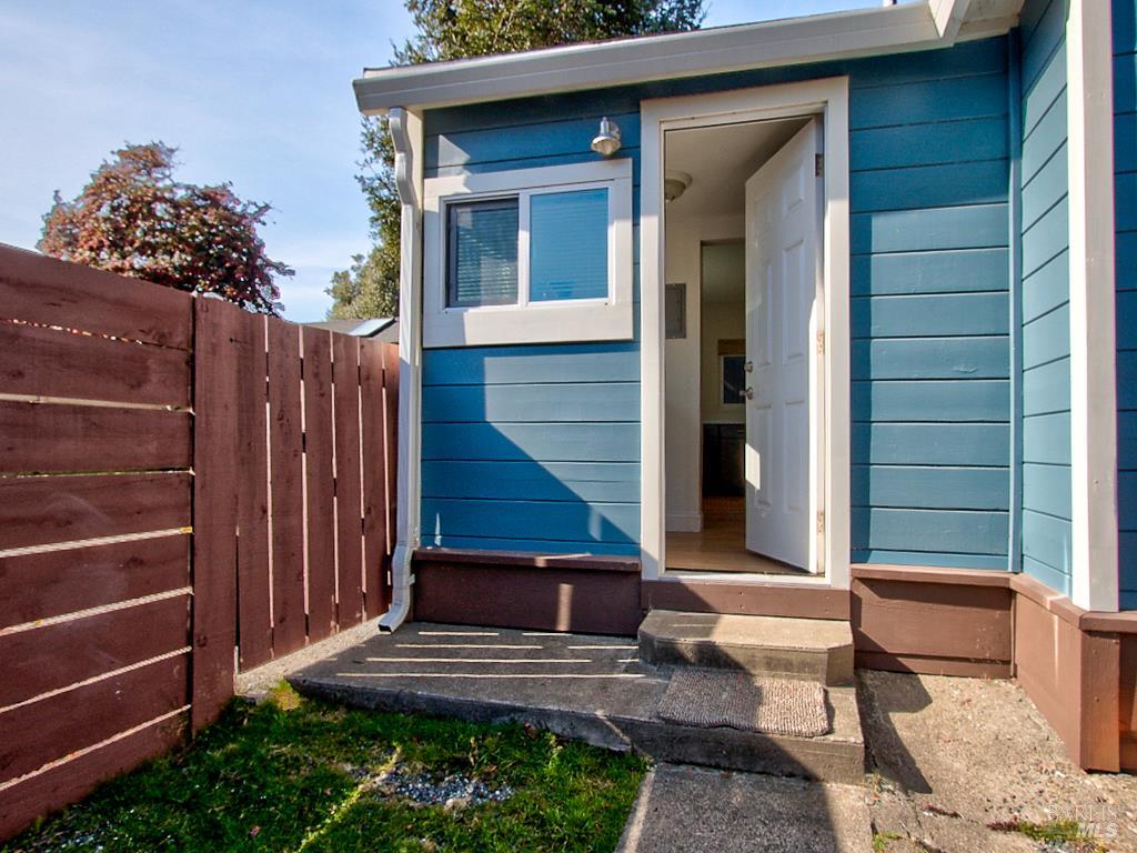 1002 Cedar Street Fort Bragg, CA 95437 - Photo 20 of 26 a front view of a house with a yard