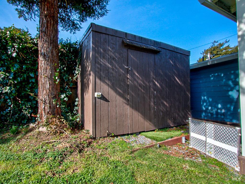 1002 Cedar Street Fort Bragg, CA 95437 - Photo 23 of 26 a backyard of a house with lots of green space