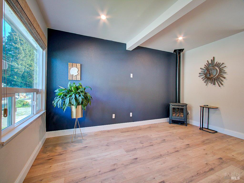 1002 Cedar Street Fort Bragg, CA 95437 - Photo 4 of 26 a view of an empty room with a window