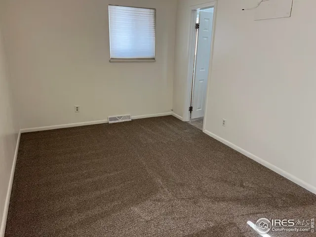 a view of a hallway with windows