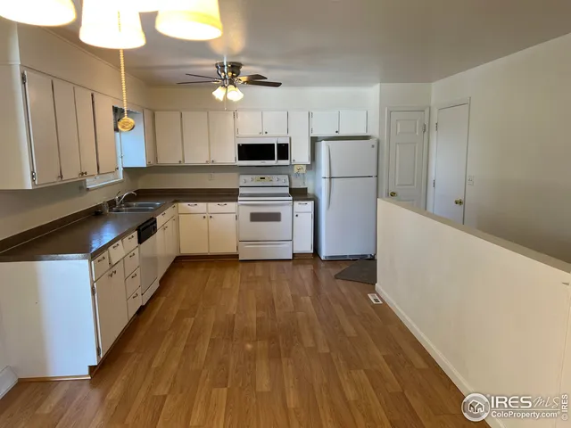a bathroom with a sink toilet and a mirror