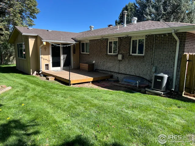 a view of a house with backyard porch and sitting area