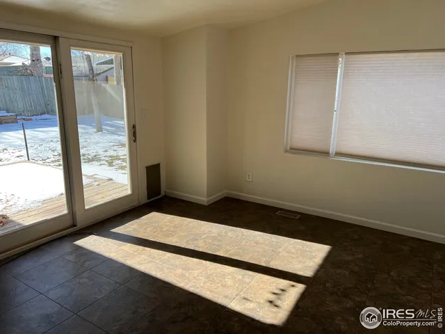 a view of an empty room and window