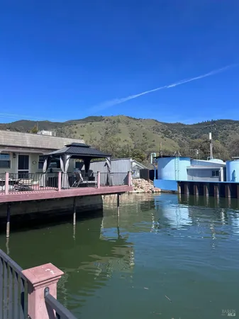 a view of house with swimming pool yard and outdoor seating