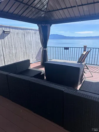 a view of balcony with wooden floor