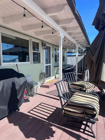 a outdoor space with furniture and a fireplace