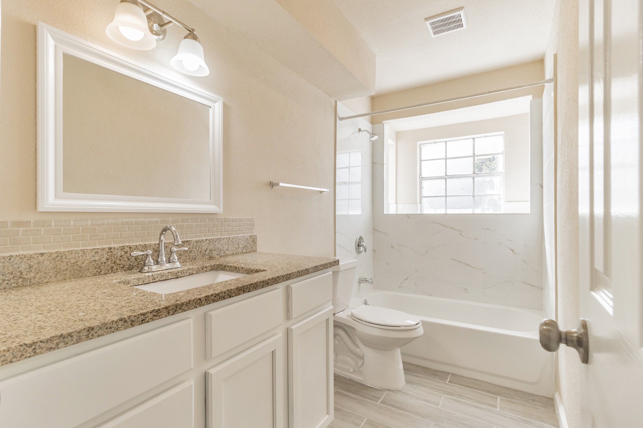 6815 Beachwood Street, Unit 1 Houston, TX 77021 - Photo 13 of 20 a bathroom with a granite countertop sink toilet and shower