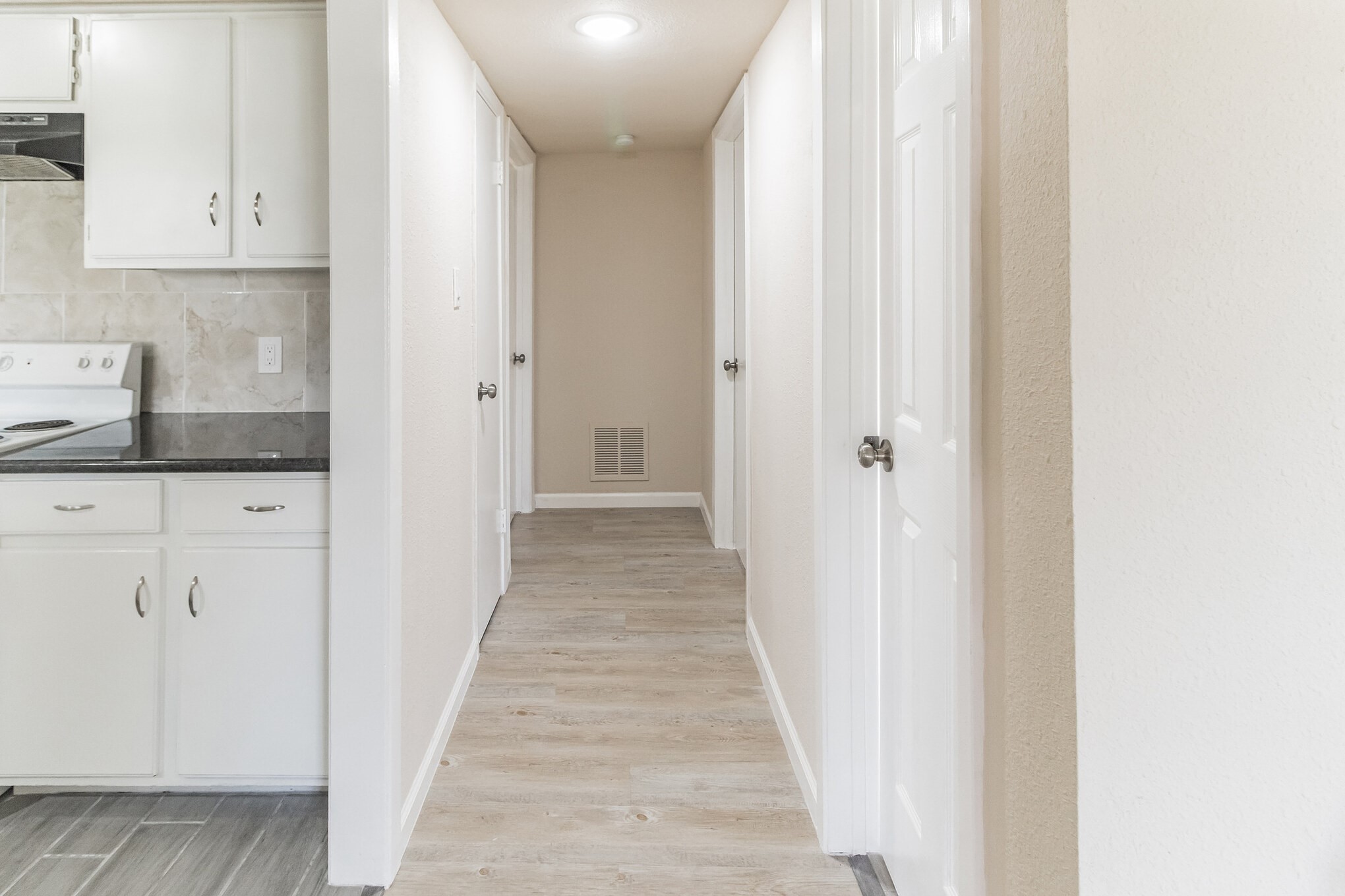 6815 Beachwood Street, Unit 1 Houston, TX 77021 - Photo 20 of 20 a view of a kitchen with white cabinets