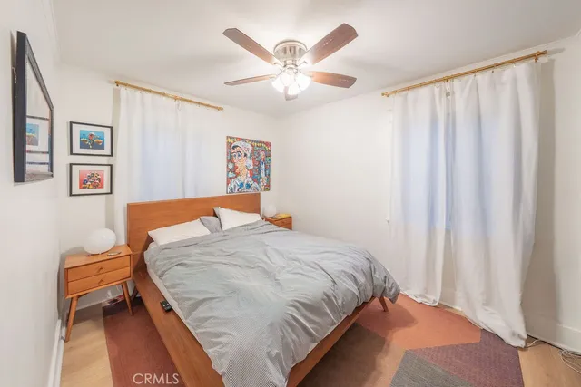 a view of a livingroom with furniture and a ceiling fan