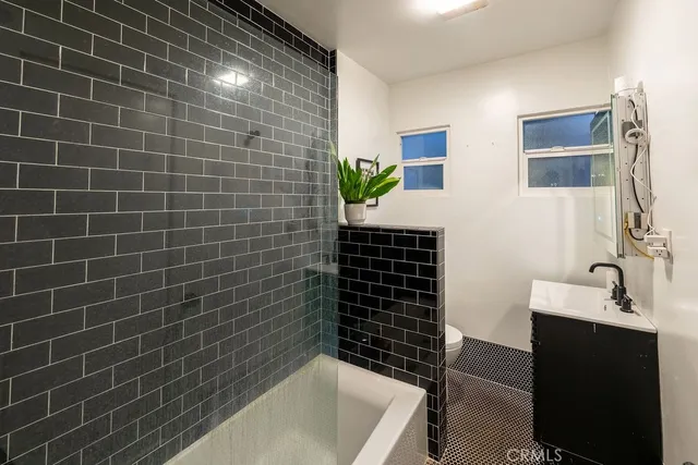 a bedroom with a bed furniture and a book shelf