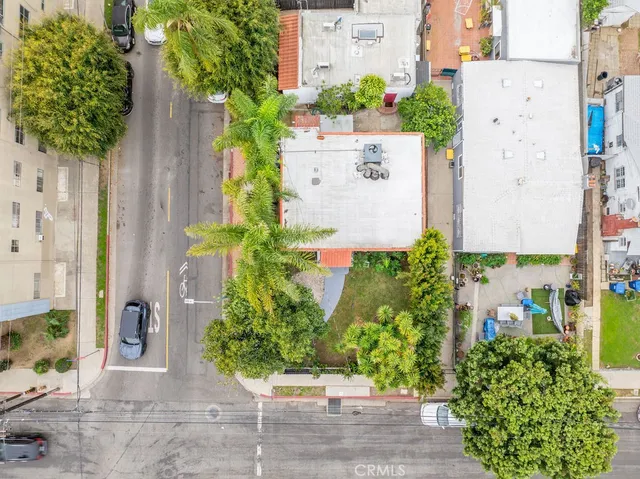an aerial view of a house with a yard and garden