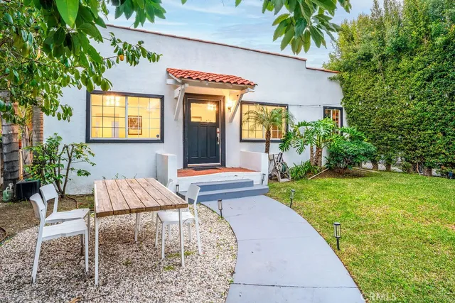 a front view of house with yard and seating area