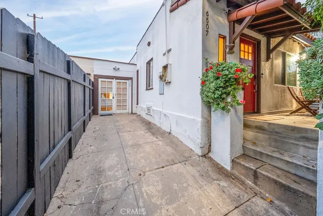 a view of a house with a flower garden