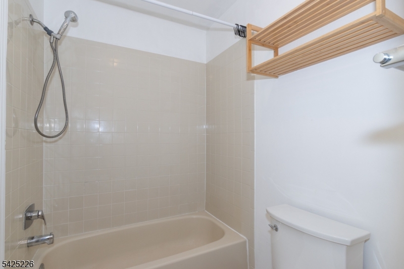 90 Mayfield Road, Unit 90 Bedminster, NJ 07921 - Photo 25 of 38 a bathroom with a bath tub with a shower