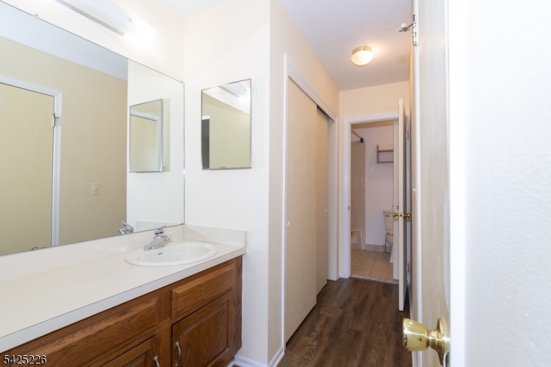 90 Mayfield Road, Unit 90 Bedminster, NJ 07921 - Photo 27 of 38 a en suite bathroom with a sink shower and a mirror