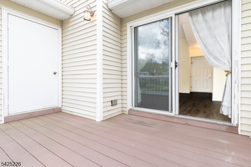 90 Mayfield Road, Unit 90 Bedminster, NJ 07921 - Photo 32 of 38 a view of a room with wooden floor and a window