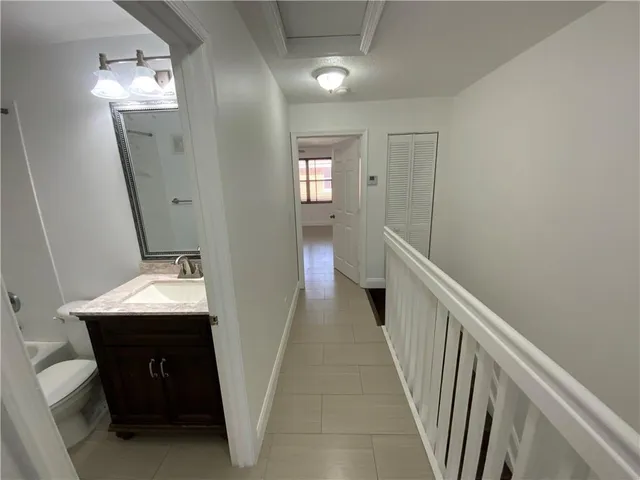 a view of a hallway with windows