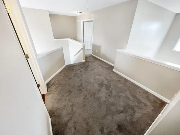 a view of kitchen and wooden floor