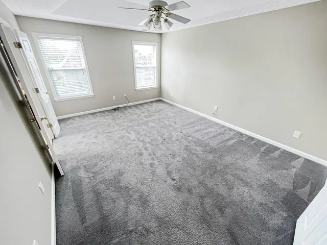 a view of entryway with wooden floor and stairs