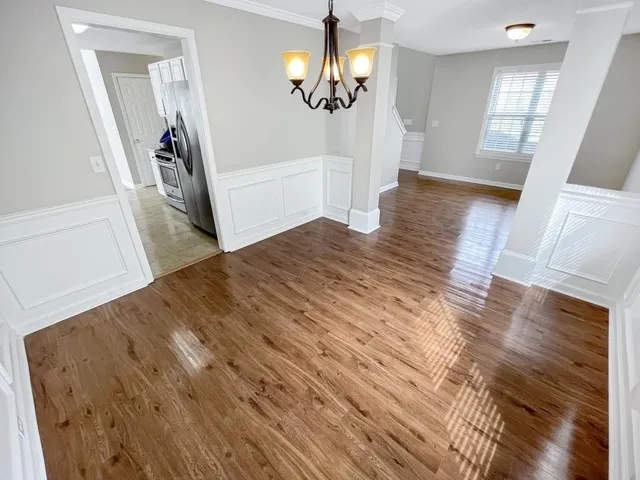 a view of a living room and hardwood floor