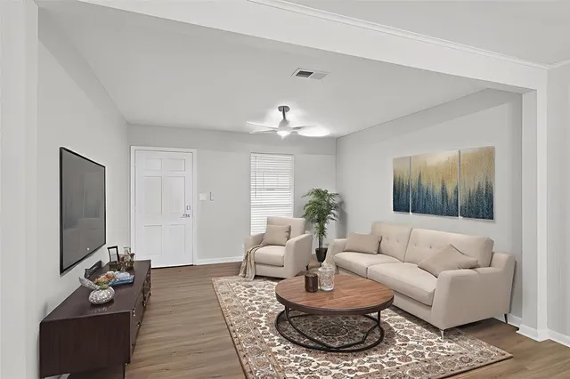 a view of a kitchen with a sink and a refrigerator