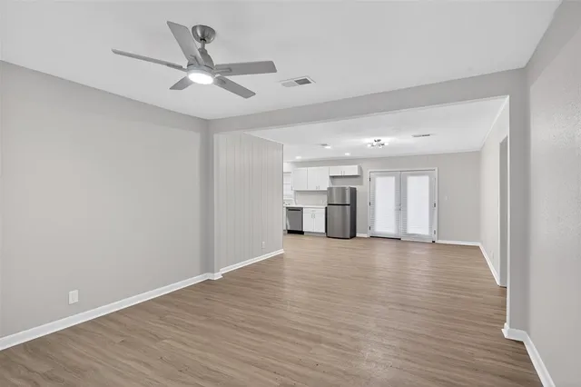 a view of a dining room with furniture and a chandelier