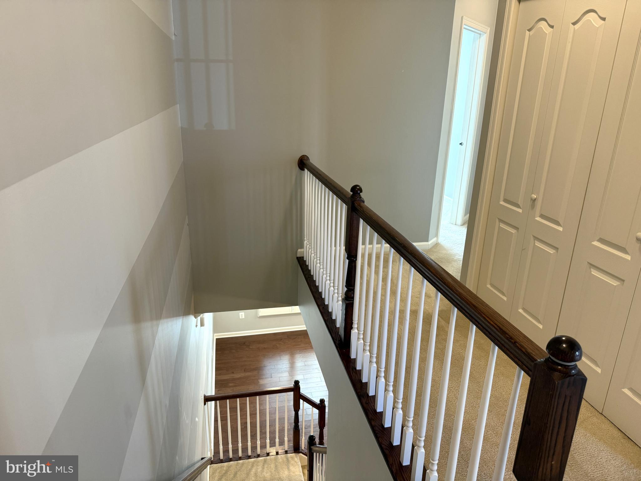 43132 Thoroughfare Gap Terrace Ashburn, VA 20148 - Photo 16 of 18 a view of staircase with railing and white walls