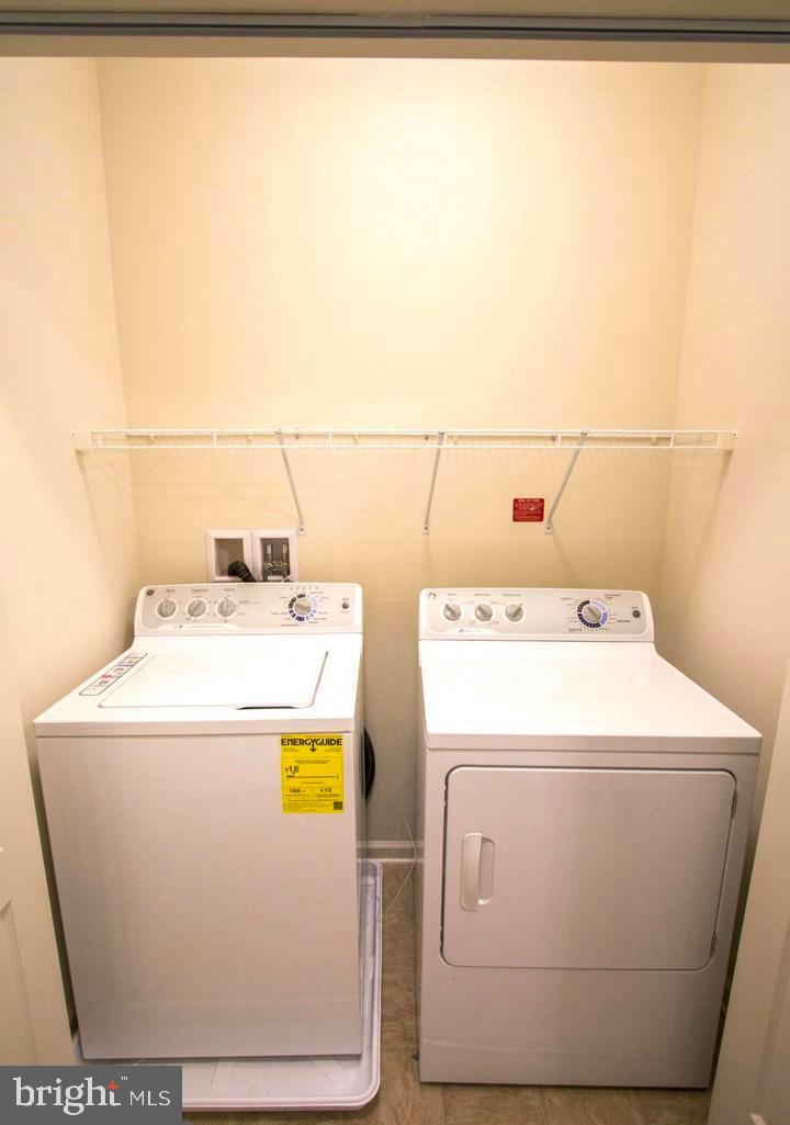 43132 Thoroughfare Gap Terrace Ashburn, VA 20148 - Photo 17 of 18 a utility room with dryer and washer